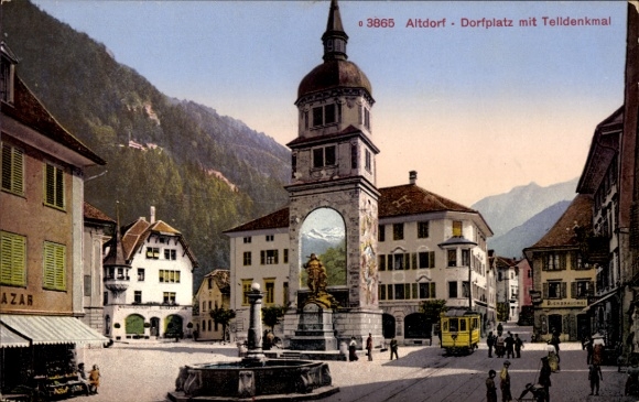 Ak Altdorf Kt Uri, Dorfplatz mit Telldenkmal,  Brunnen, Gebäude, Straßenbahn