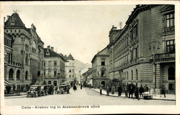 Ak Celje Cilli Slowenien,  Krekov trg, Aleksandrova ulica, alte Autos, Menschen auf der Straße