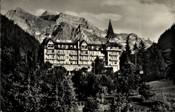 Ak Flüeli Ranft Sachseln Kt. Obwalden, Hotel Nunalphorn, Paxmontana, Berge im Hintergrund, Schwar